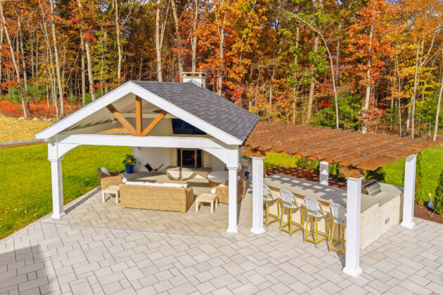 Backyard patio, pavilion, fireplace, pergola, and outdoor kitchen design and build by Dex by Terra in North Attleboro, Massachusetts.