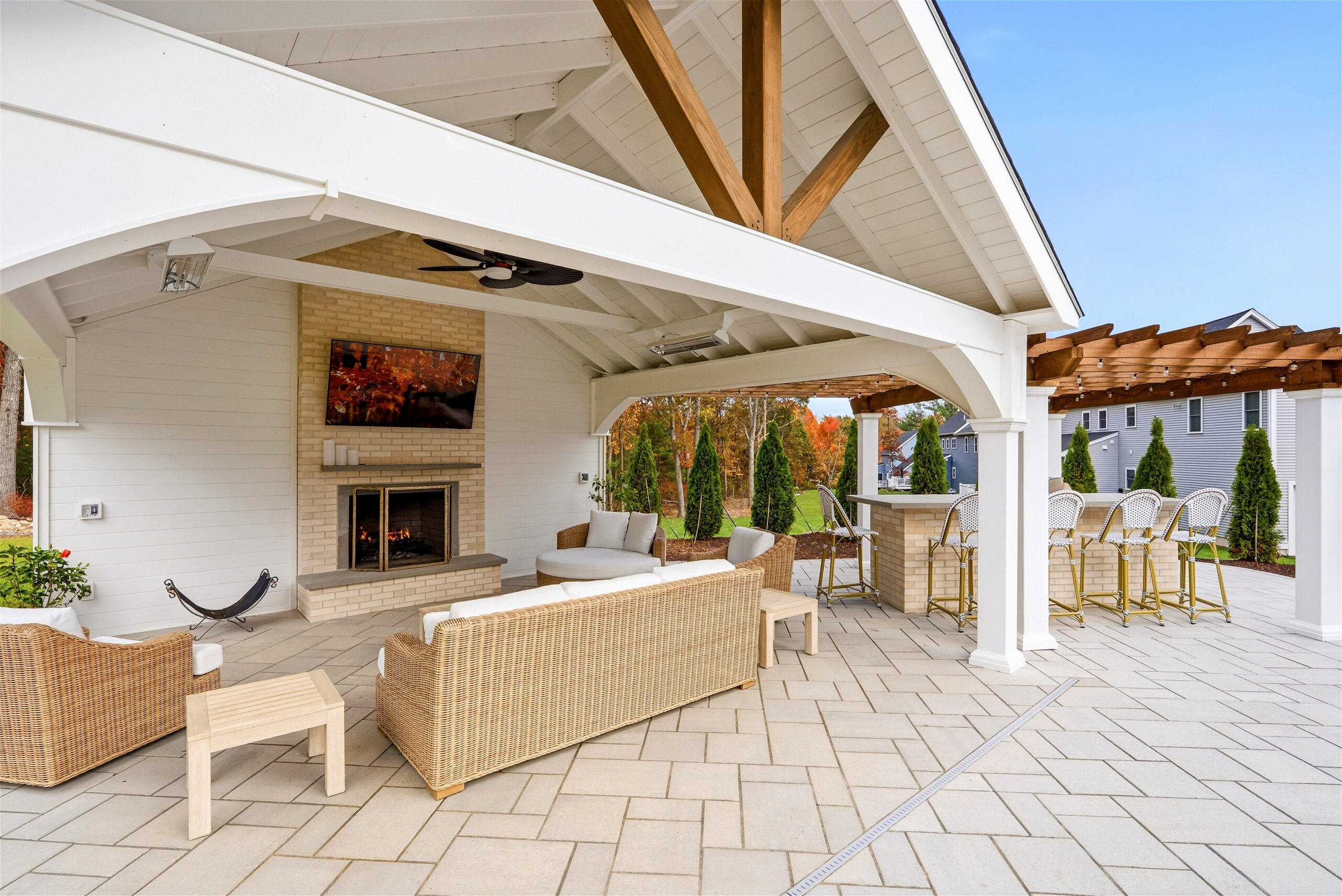 Patio pavilion with privacy wall and fireplace designed and built by Dex by Terra in North Attleborough, MA.