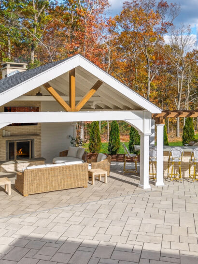 Backyard patio, pavilion, fireplace, pergola, and outdoor kitchen design and build by Dex by Terra in North Attleboro, Massachusetts.
