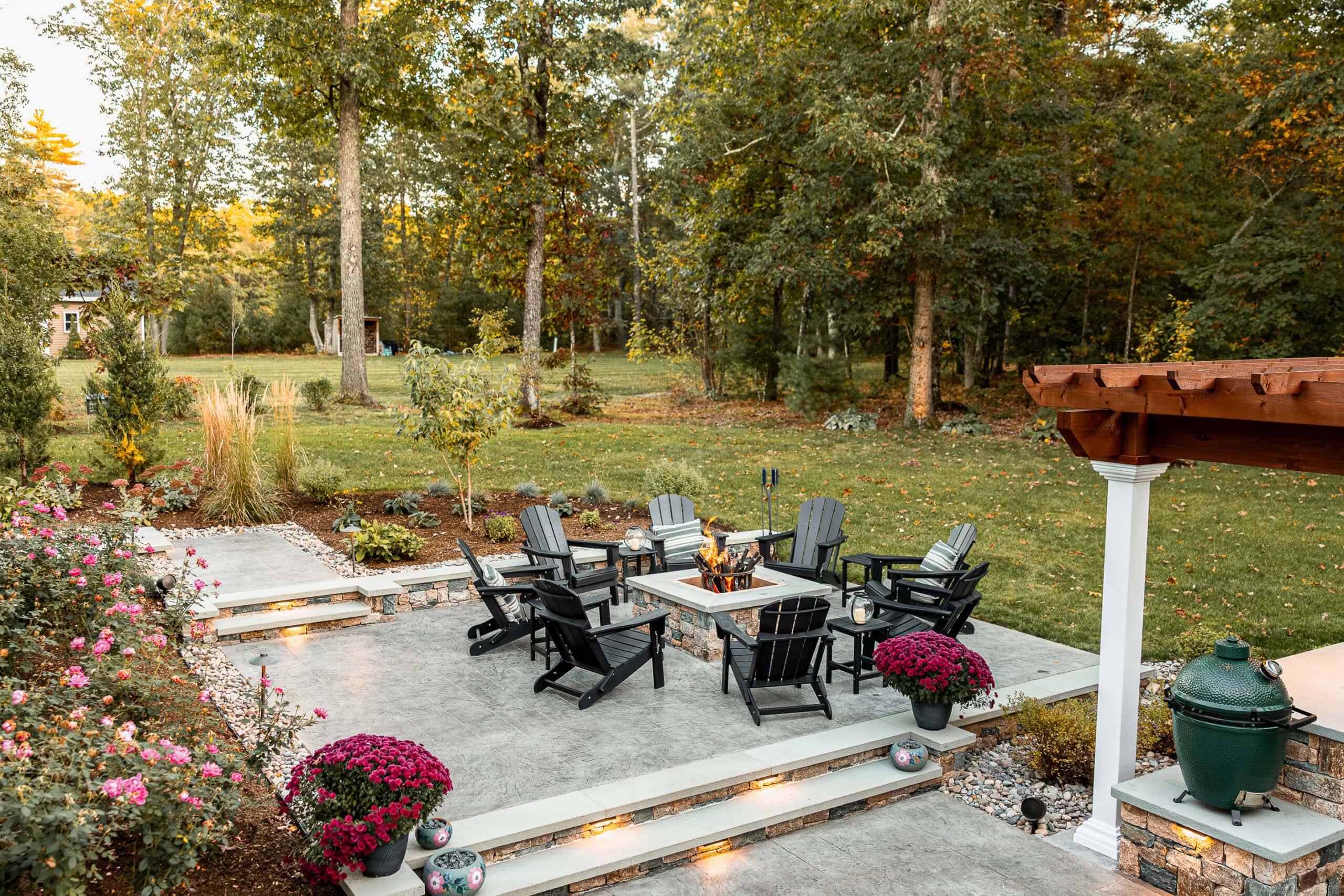 Steps leading to the fire pit patio. Landscape design in Dunstable, MA built by Dex by Terra.