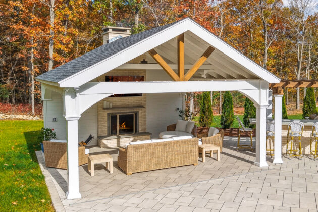 Patio pavilion with privacy wall and fireplace designed and built by Dex by Terra in North Attleborough, MA.