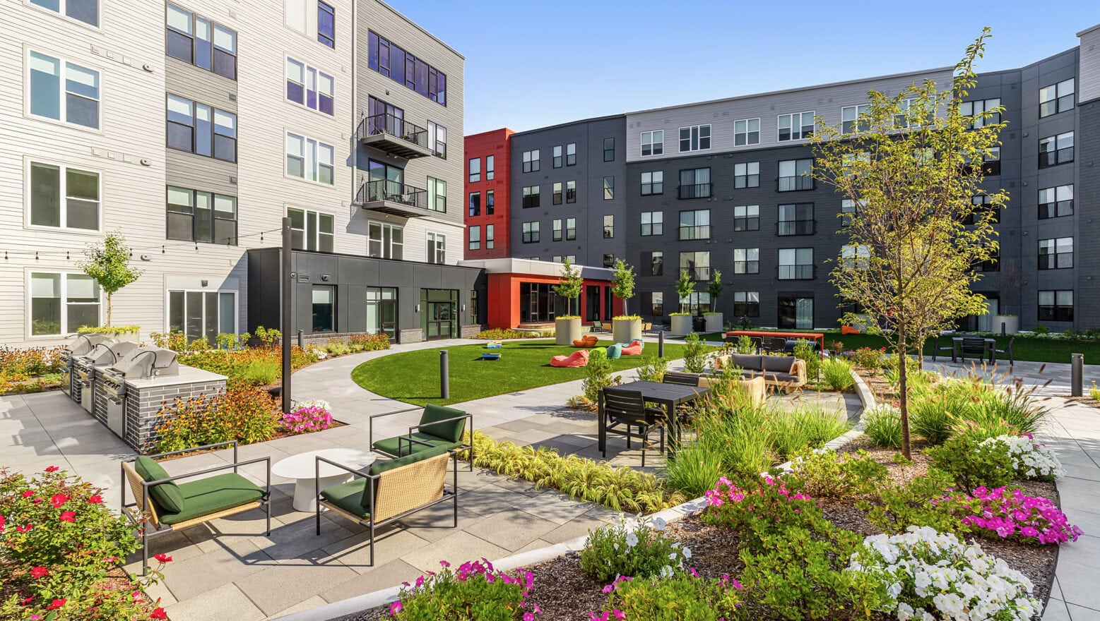 The courtyard with walkways, and patios at The Revington in Worcester, MA. Hardscape and Landscape project built by Dex by Terra.