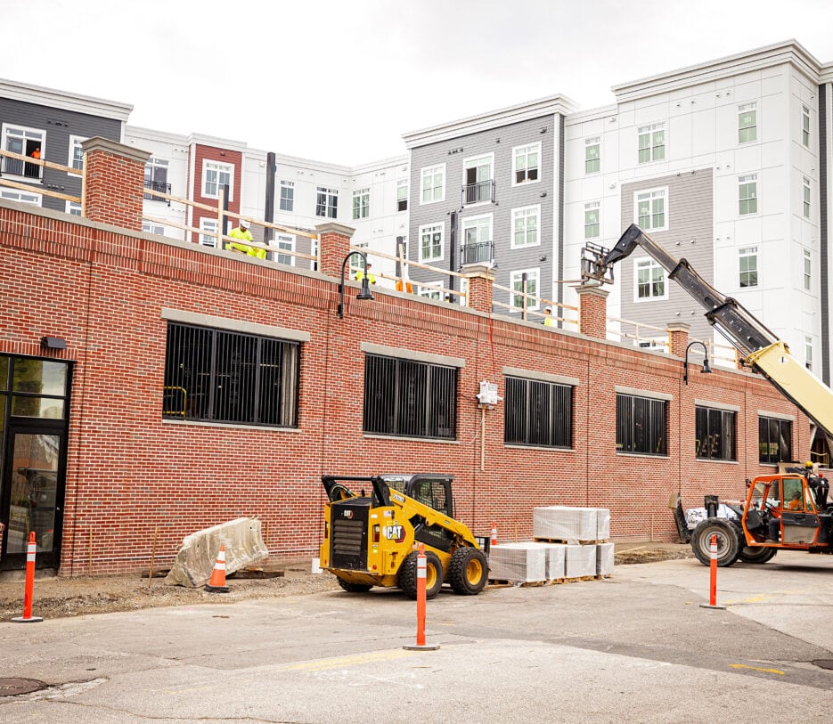 Construction of the second floor courtyard amenity area at 75 Canal Apartments in Manchester, NH. Hardscaping and landscaping by Dex by Terra of Hudson, MA.